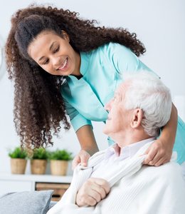 Nurse Caring for Nursing Home Patient